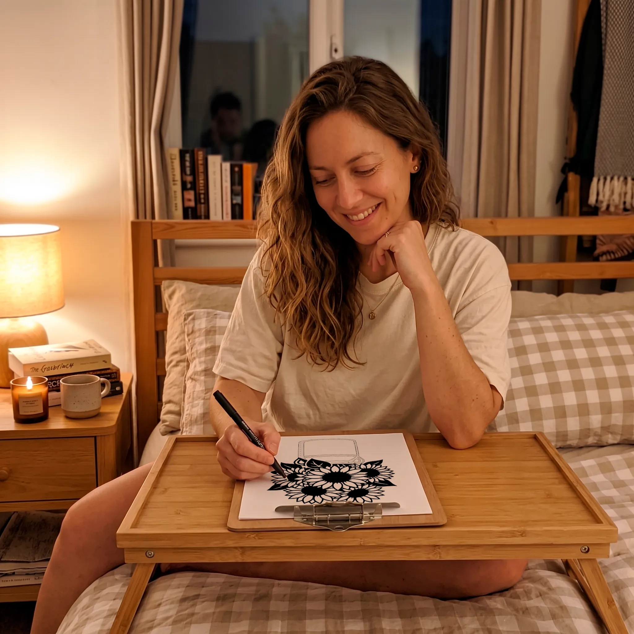 Woman coloring calmly in bed with a clipboard, phone put away
