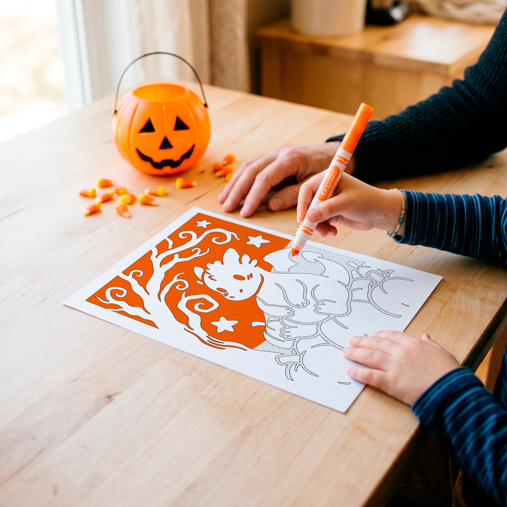 Child's hand holding a marker over a bold printable coloring page